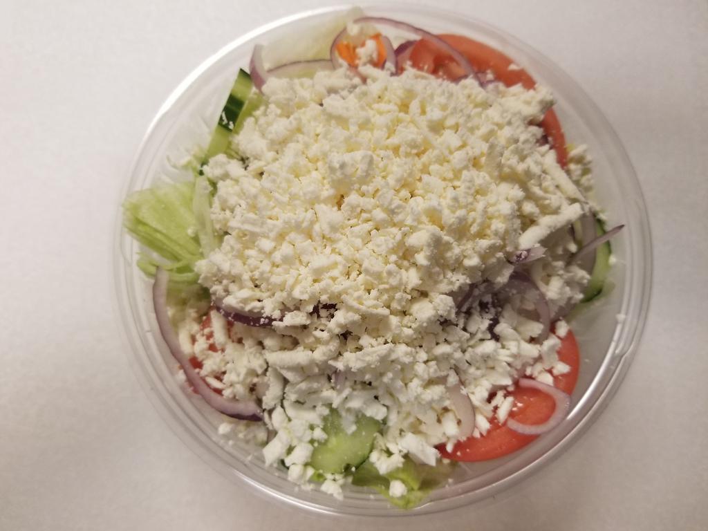 Greek Salad · Peter garden salad topped with feta cheese. Served with Syrian pita and dressing on the side.