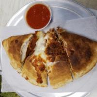 Chicken Parmesan Calzone · Chicken cutlet with marinara sauce. Made with fresh daily dough, house cut mozzarella, provo...
