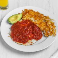 Huevo Ranchero · A quesadilla filled with chorizo, refried black beans and cheddar cheese, topped with 2 eggs...