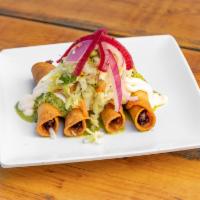 Chicken Taquito · 4 crispy shredded chicken taquitos, topped with curtido, and our green tomatillo sauce.