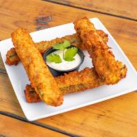 Zucchini Sticks · Fresh, beer battered zucchini sticks, fried, and served with a habanero lime sauce.
