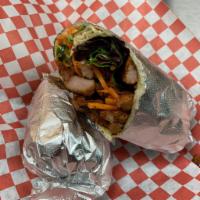 Wrap · Pickled carrots, daikon, mixed greens, spicy garlic aioli, and jalapenos wrapped in a tortil...