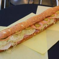 Italian Combo Sandwich · Dry salami, ham, cotto salami, pressed ham and cheese. Mustard, mayo, lettuce, tomatoes, pic...