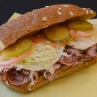 Pastrami Sandwich · Mustard, mayo, lettuce, tomatoes, pickles, and onions.