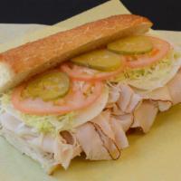 Roasted Turkey Breast Sandwich · Mustard, mayo, lettuce, tomatoes, pickles, and onions.