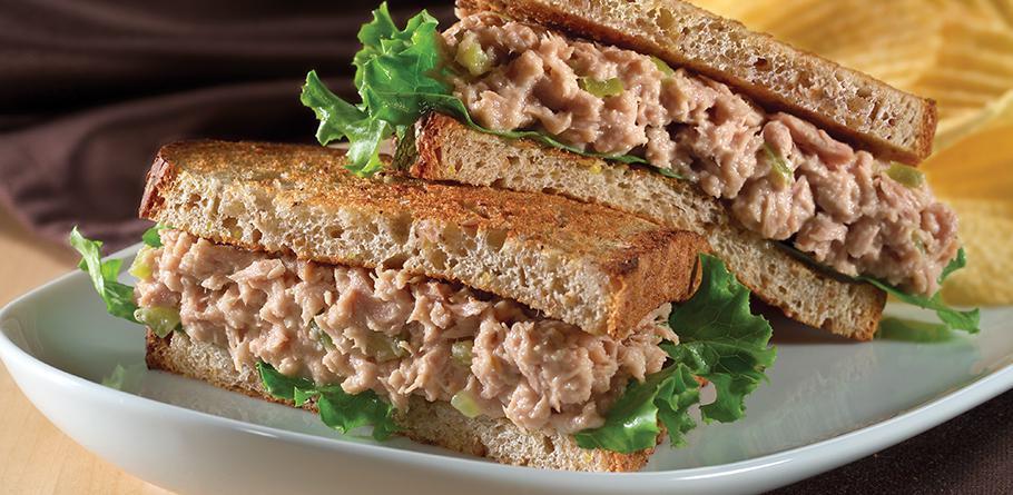 Classic Tuna Sandwich · Flaked tuna mixed with mayo, lettuce, tomato and served on a hero.