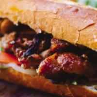Banh Mi Heo / Grilled Pork Sandwich · Traditional Vietnamese sandwich made of toasted French baguette with grilled pork top with c...