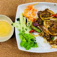 58. Bun Bo Xao Sa oT · Stir fried lemongrass chili beef served on rice vermicelli.
Grilled chicken on rice vermicel...