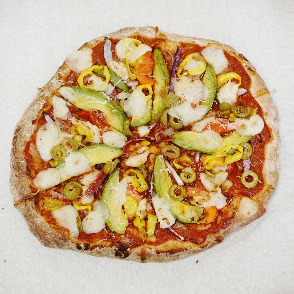 Avo Maria Pizza · VEGAN. Soy-free.
--
Avocado, marinara, tomato, onion, red bell pepper, green olives, banana peppers, roasted garlic herbs, organic mozzarisella, parmesan, wheat crust.
-- 
For Gluten-free crust options, GF pizzas are baked in proximity to wheat flour and may not be suitable for severe allergies.