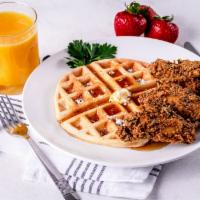 FRIED CHICKEN & WAFFLE · Crispy Chicken Wings over Belgian Style Waffles Sprinkled with Powdered Sugar and Maple Syrup