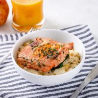 SALMON BOWL · Pan Seared Alaskan Salmon served over a bed of Breakfast style potatoes