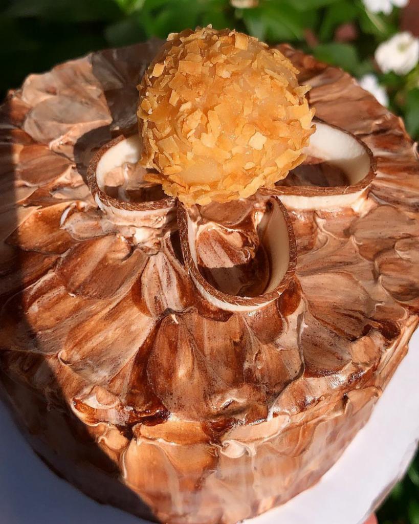 Coconut Dulce De Leche Mini Cake · A delicious mini cake filled with pieces of coconut mixed with dulce de leche inside and out.

