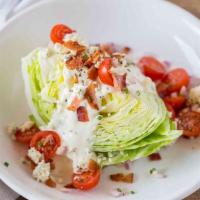 Wedge Salad  · tomatoes, bacon, Maytag blue cheese, ranch 