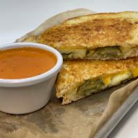 A Big Dill Grilled Cheese · Sharp cheddar, white cheddar and sliced dill pickles on sourdough.$12.00