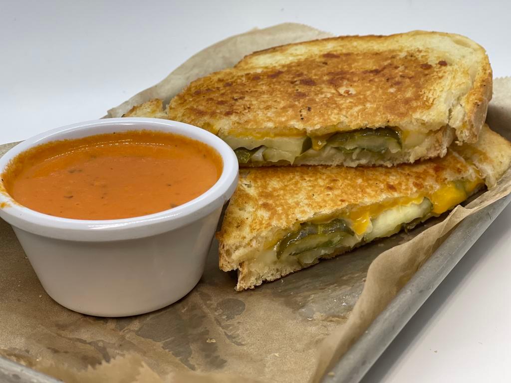 A Big Dill Grilled Cheese · Sharp cheddar, white cheddar and sliced dill pickles on sourdough.$12.00