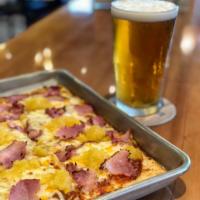 Hawaiian Pizza · Thin flatbread covered in mozzarella, cheddar, provolone. With applewood ham and pineapple.