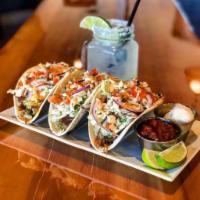 Pulled Pork Tacos · 3 huge pulled pork tacos with Napa cabbage slaw, tomato, house salsa and guacamole, sour cre...