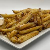 Truffle Fries · Thin cut fries tossed in delicious white truffle oil and seasoned to perfection with garlic ...