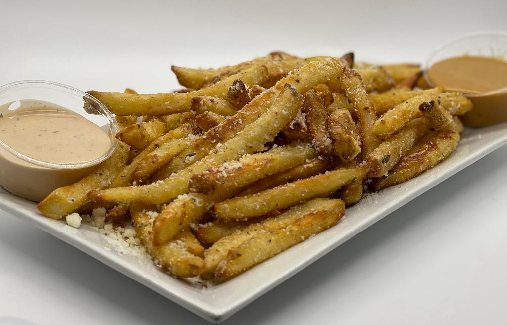 Truffle Fries · Thin cut fries tossed in delicious white truffle oil and seasoned to perfection with garlic and Parmesan.