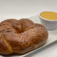 Pretzel with Cheese · Soft baked pretzel brushed with hot garlic Parmesan butter and served with house-made beer c...
