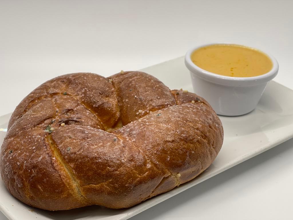 Pretzel with Cheese · Soft baked pretzel brushed with hot garlic Parmesan butter and served with house-made beer cheese (jalapeno or original).