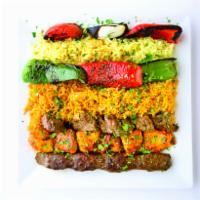 Mixed Grill · An assortment of chicken beef and kifta with grilled veggies, side of pita bread over tanoor...