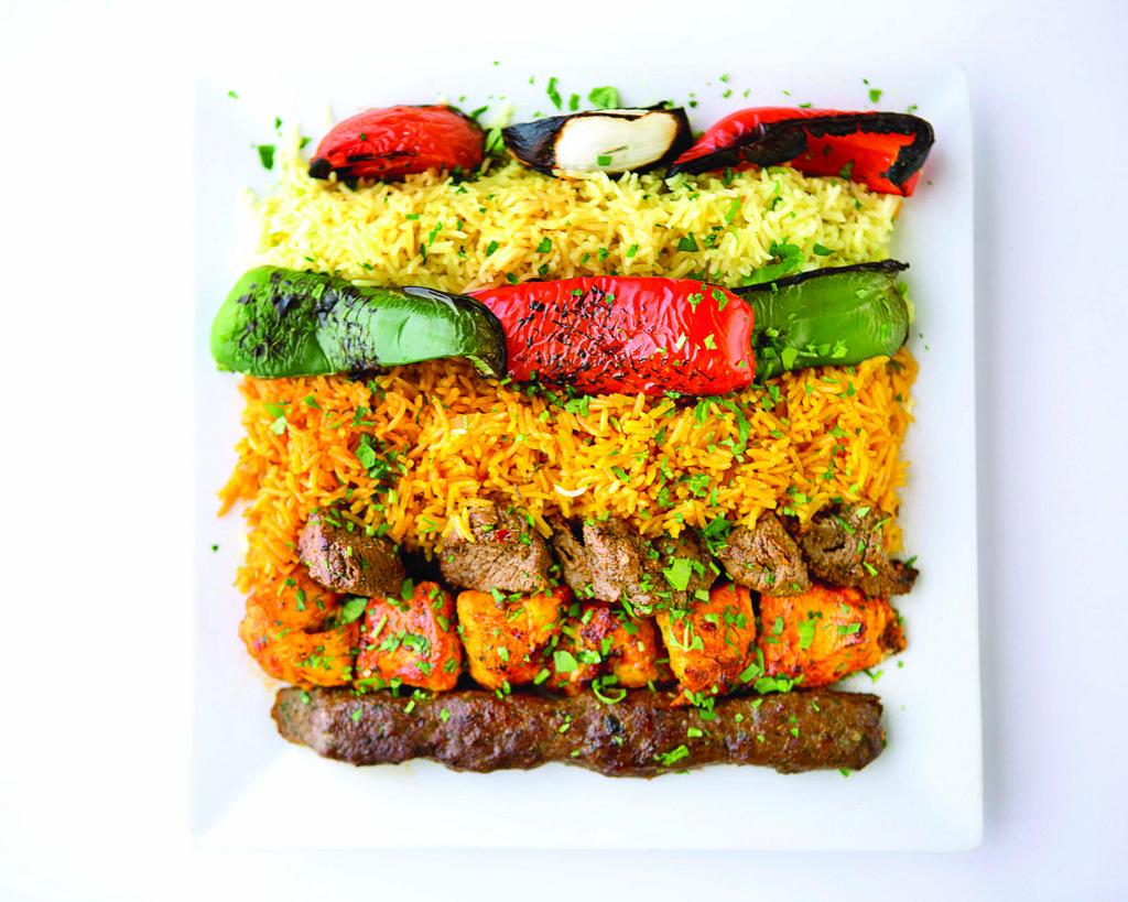 Mixed Grill · An assortment of chicken beef and kifta with grilled veggies, side of pita bread over tanoor rice.