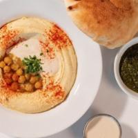 HUMMUS PLATE & PITA · Creamy home-made hummus base with tahini and chickpeas, served with your choice of protein, ...
