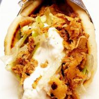 Chicken Delight Wrap · Marinated chicken over a hot pita with lettuce, tomato and tzatziki sauce.