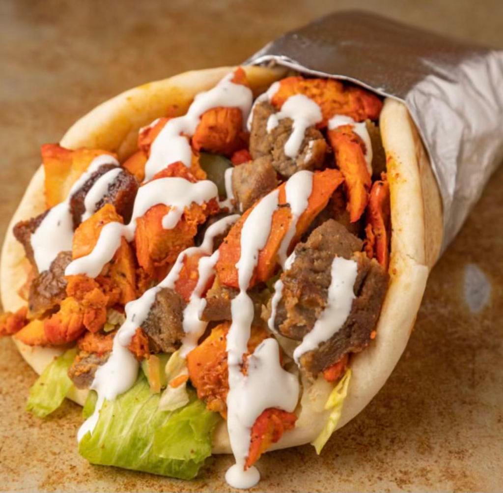 Mix Gyro · Chicken and lamb on pita bread sandwich with your choice of salad and sauce 
PlEASE Tell US YOUR Choice OF Salad and Sauce in special instructions in order to serve you better