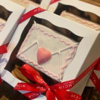 Valentine's Day Cookie Box (12pc) · One large hand decorated cookie & 11 heart shaped linzer cookies