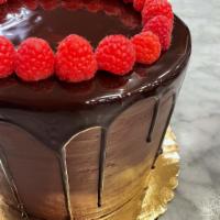 Raspberry Chocolate Cake · 24 HR NOTICE REQUIRED. Moist chocolate sponge cake layered alternately with raspberry fillin...