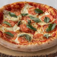 Margherita Pizza · Tomato, oregano, fresh garlic, fresh basil and fresh mozzarella.