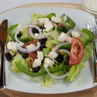 Greek Salad · Tomato, onion, green peppers, olives, and feta cheese.