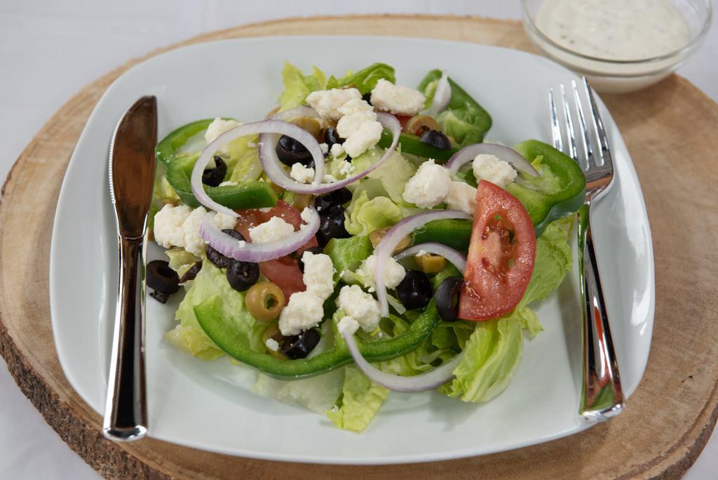 Greek Salad · Tomato, onion, green peppers, olives, and feta cheese.