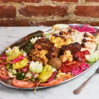 Vegetarian Combo Platter For 2 · Humus, babaganoush, falafel, grape leaves, tabbouleh, mousaka , five bean salad and cauliflo...