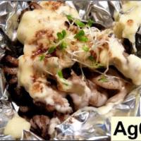 Ag6. Ishiyaki Geso Mayonnaise · Stone grilled squid tentacles wrapped in aluminum foil and topped with mayonnaise.