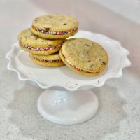 Chocolate Chip Buttercream Sandwich · Two delectable chocolate chip cookies sandwiched with vanilla buttercream and rolled in rain...