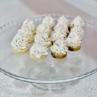 Buttercream Bites · Bite size sugar cookies and cookie cake topped with Buttercream Icing and sprinkles! Yum!