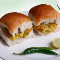 Bombay Vada Pav · 2 pieces. Deep-fried potato patty with cilantro and Indian spices. Served on pav bread with ...