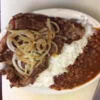 Grill shell steak with rice and beans ( onions and peppers) · 