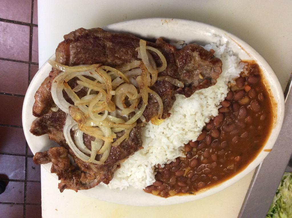 Grill shell steak with rice and beans ( onions and peppers) · 
