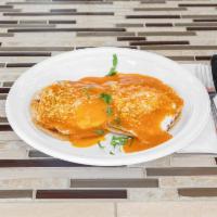 Huevos Rancheros (Vegetarian) · Sunny side up eggs in a spicy red tomato sauce served with rice, beans, and tortillas 
