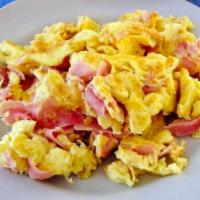 Huevos con Jamon · Ham with scrambled eggs served with rice, beans, tortillas and side salsas. 