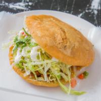 Gorditas · Homemade corn dough fried and topped with: lettuce, tomato, sour cream, cheese and cilantro....