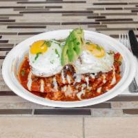 Chilaquiles with meat · Tortilla chips soaked in choice of red or green sauce. Topped with sour cream, cotija cheese...