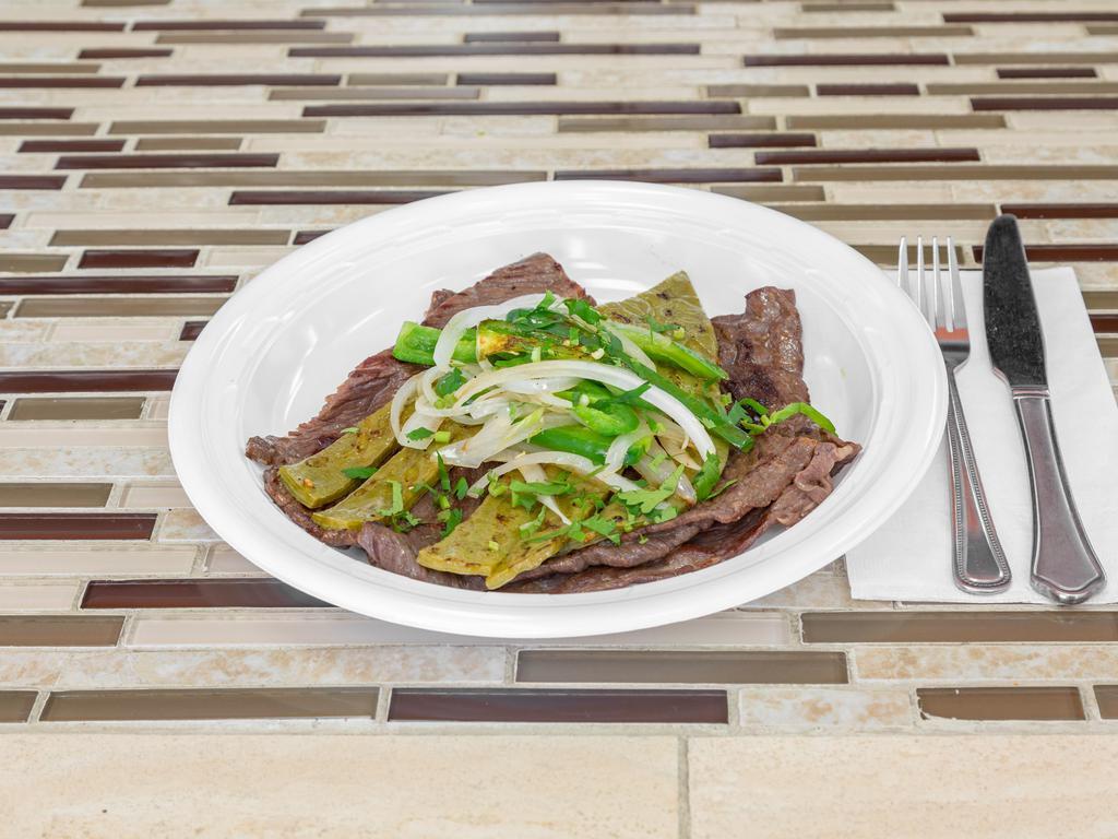 Cecina Asada con nopales, rajas y cebolla  · Salted beef with grilled cactus, sauteed onions and roasted jalapenos. Served with rice, beans, and tortillas 