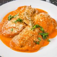 Chiles Rellenos (Vegetarian) · (2) Poblano peppers stuffed with cheese and served in a light tomato broth. Served with rice...