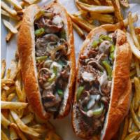Philly Cheesesteak - New · Seasoned steak strips, melted American Cheese, peppers, onion, homemade chipotle sauce on a ...