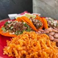 Taco Plate · 3 corn tortilla tacos with birria, onions, cilantro, rice and beans. 